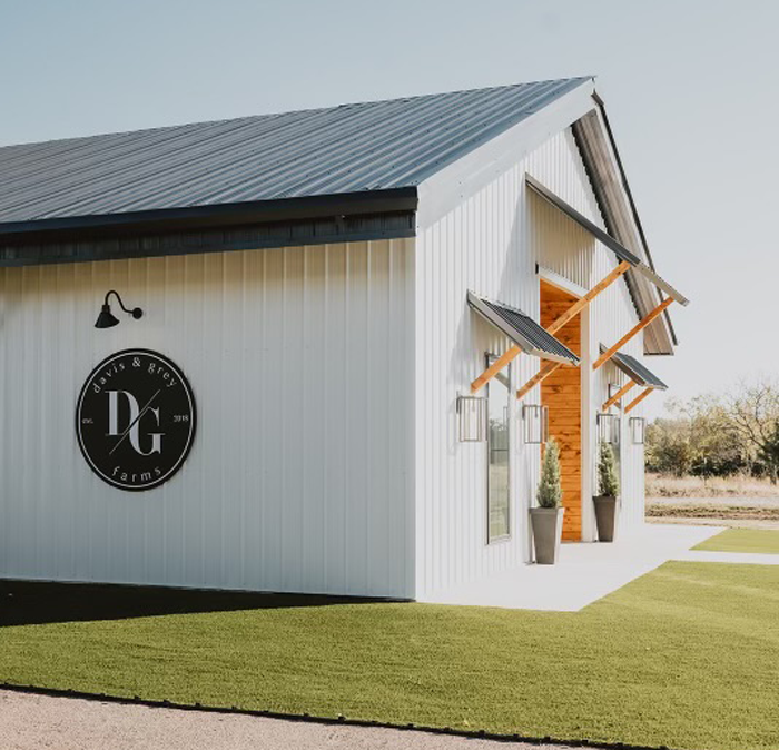Metal building exterior detail with timber accents and custom signage