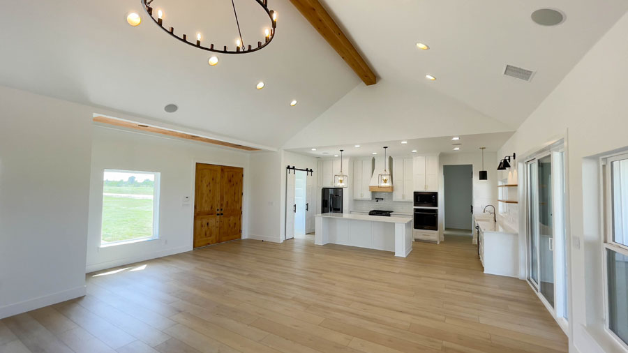 Barndominium interior with open floor plan and vaulted ceiling