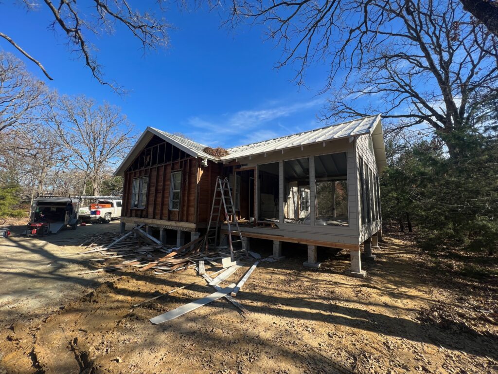 How long does it take to build a barndominium? A home under construction on an East Texas lot by 1802 Build Co.