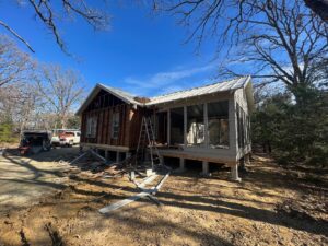 How long does it take to build a barndominium? A home under construction on an East Texas lot by 1802 Build Co.
